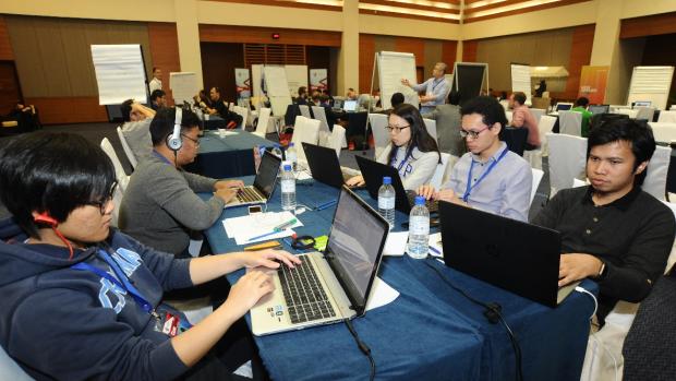 Attendees working on their computers